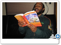 Ziggy Marley on his tour bus reading Sanctuary of the Divine Presence by Zohara Hieronimus.